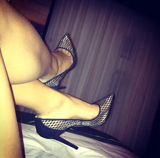 Karrueche Tran - The classic pointed-toe pump with an edgy twist! Karrueche Tran kicked her feet up in the mesh “Pigalle” pump by Christian Louboutin.  (Photo: Karrueche Tran via Instagram)