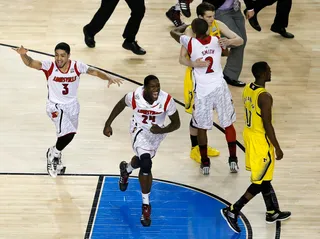 For the Win! - The Cardinals' Peyton Siva Montrezl Harrell and Russ Smith celebrate after they won 82-76 over Michigan.&nbsp;(Photo: Kevin C. Cox/Getty Images)