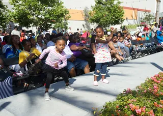 Work the Runway - Two pint-sized models warm up the audience by showing off their dance skills before the fashion show took place.(Photo: Earl Gibson/BET/Getty Images for BET)