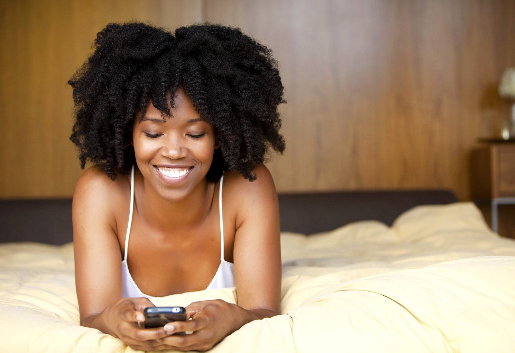 woman typing on her cellphone