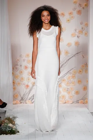 LC Lauren Conrad Collection - The MTV reality-star-turned designer rings in her first NYFW this season. Survey says? It’s a hit! We’d love to slip into this floaty white number with sweet ruffle details now. (Photo: Thomas Concordia/WireImage)