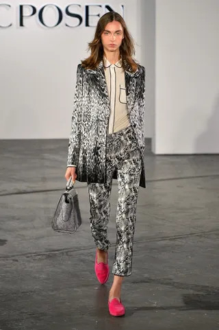 ZAC Zac Posen Collection - Crazy for prints? You need this abstract black-and-white jacket and trousers in your life. And don’t forget a pop of color with your accessories.  (Photo: Slaven Vlasic/Getty Images for Google)