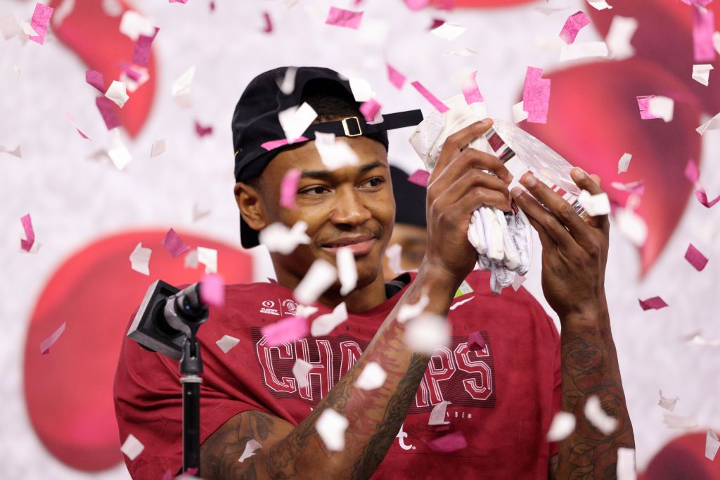 ARLINGTON, TEXAS - JANUARY 01: Wide receiver DeVonta Smith #6 of the Alabama Crimson Tide celebrates receiving Offensive Player of the Game, after winning in the 2021 College Football Playoff Semifinal Game at the Rose Bowl Game presented by Capital One 31-14 over the Notre Dame Fighting Irish at AT&T Stadium on January 01, 2021 in Arlington, Texas. (Photo by Ronald Martinez/Getty Images)