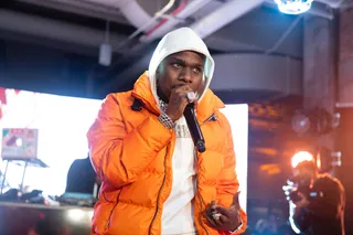 FEB 15:&nbsp;DaBaby - DaBaby performs at the Hennessy All-Star Saturday Night wearing an orange Parajumpers coat. (Photo:&nbsp;Noel Vasquez/Getty Images for Hennessey)