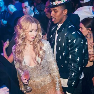 Ball Drop - They rang in the New Year in glitter bomb fashion at Drai’s Beach Club in Vegas. Her silver-and-gold fringe and sequin number was right at home beside his lightening bolt covered bomber jacket and massive diamond studs.&nbsp; (Photo: Nick Young via Instagram)