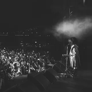 Erykah Badu - Ms. Badoula has the crowd in the palm of her hand as she sings some of her classic hits.  (Photo: @djdnice via Instagram)