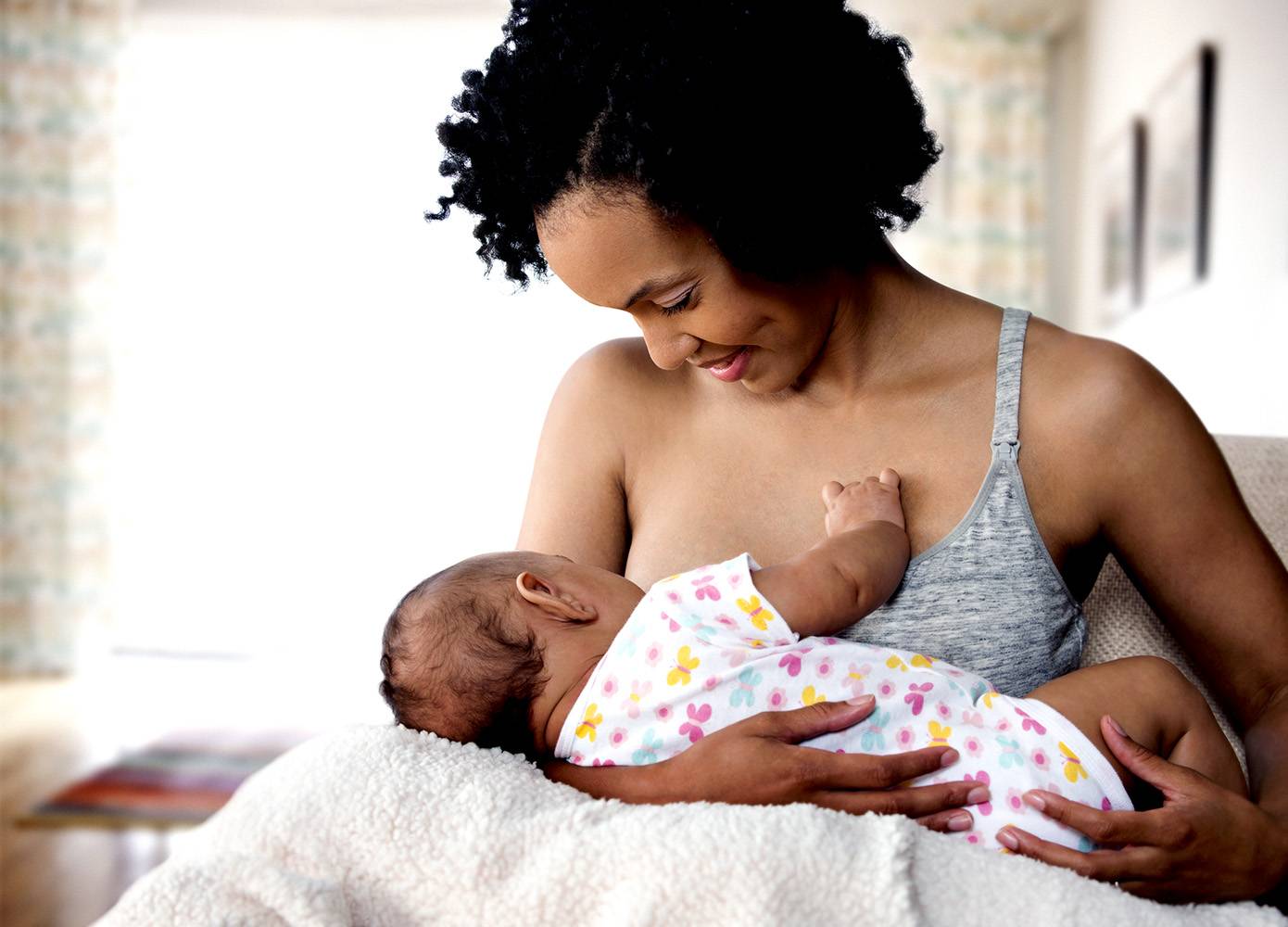 woman breastfeeding baby