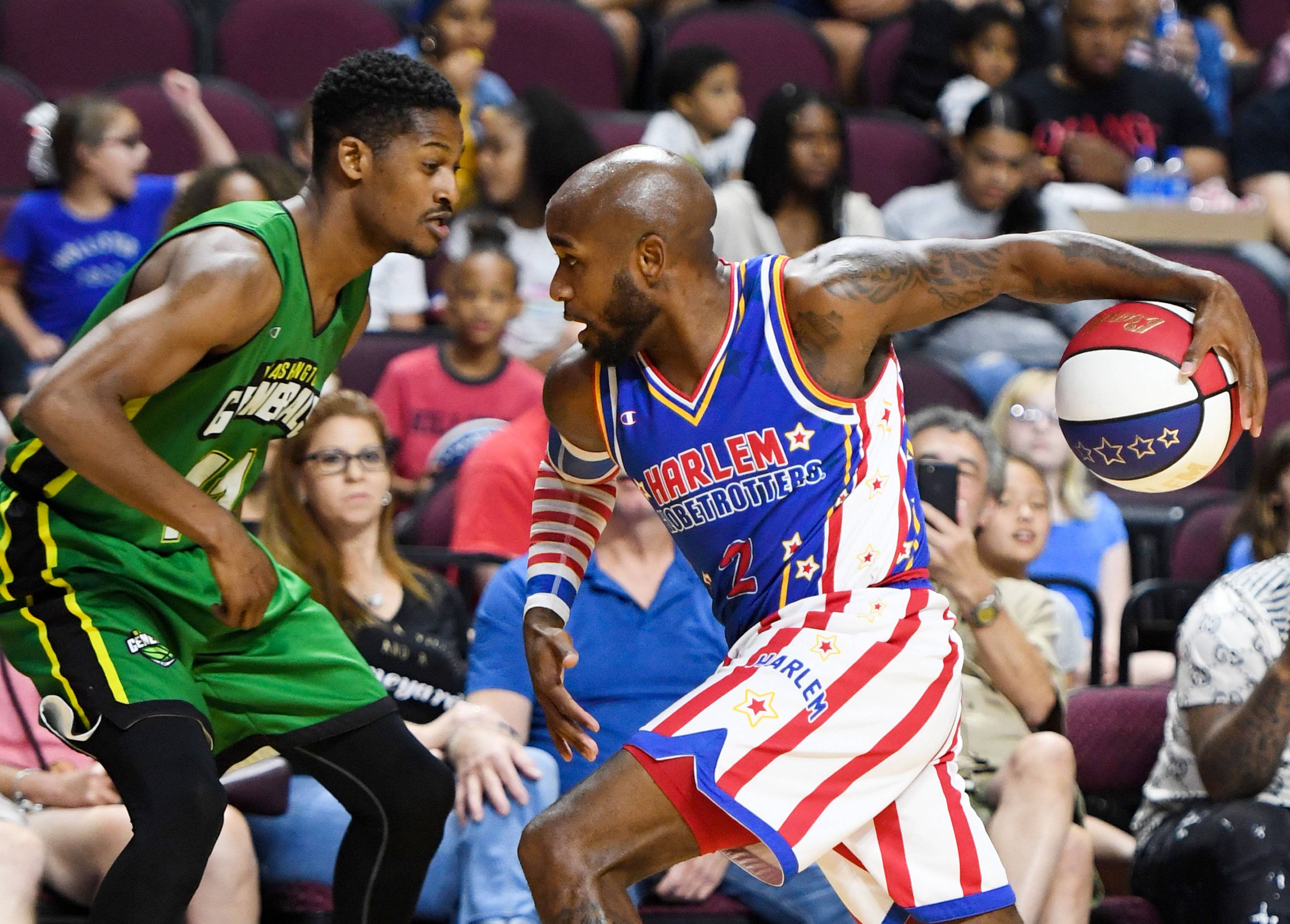 LAS VEGAS, NEVADA - AUGUST 25:  Carlos "Dizzy" English #2 of the Harlem Globetrotters drives against Shaquille Burrell #11 of the Washington Generals during their exhibition game at the Orleans Arena on August 25, 2019 in Las Vegas, Nevada.  (Photo by Ethan Miller/Getty Images)