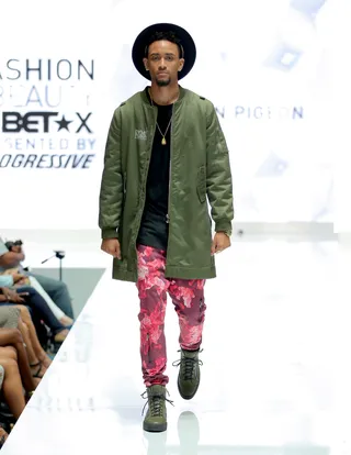 Bold Prints - This camo-and-fuchsia watercolor streetwear look keeps its rugged edge thanks to olive green lace-up boots and a wide-brim hat.  (Photo: Chelsea Lauren/BET/Getty Images for BET)