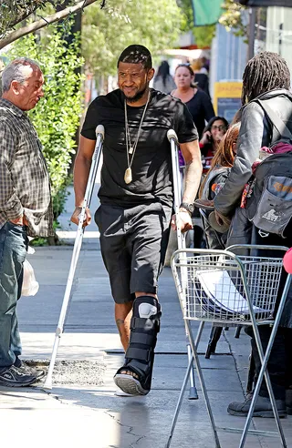 Slow Your Roll - Looks like&nbsp;Usher&nbsp;won't be busting any dance moves anytime soon. The handsome R&amp;B singer and father of two was spotted on crutches and wearing a cast after having surgery on his foot in Los Angeles.(Photo: Sharky / Splash News)