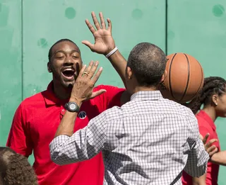 Gimme Five! - Washington Wizards basketball player John Wall congratulates the president as they play on the basketball court on the South Lawn.(Photo: AP Photo/Pablo Martinez Monsivais)