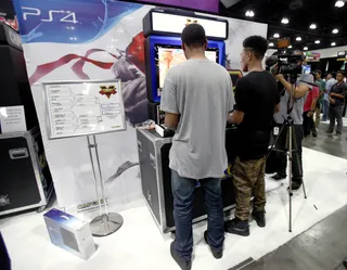 ULTIMATE GAMER - Street Fighter champion Luken and singer Adrian Marcel hit up the PS4 gaming station on day three of the 2015 BET Experience. &nbsp;(Photo: Tommaso Boddi/Getty Images for BET)