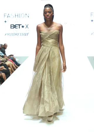 All That Glitters - This shimmery strapless gold gown is a princess fairytale come true. The layers upon layers of tulle make it.  (Photo: Jesse Grant/BET/Getty Images for BET)