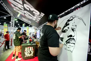 ODE TO TUPAC - An artist drew a portrait of the late Tupac Shakur at Fan Fest during the 2015 BET Experience.&nbsp;(Photo: Tommaso Boddi/Getty Images for BET)