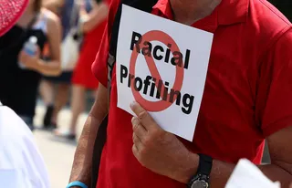 /content/dam/betcom/images/2013/06/National-06-16-06-30/073113-national-trayvon-martin-laws-racial-profiling-sign.jpg