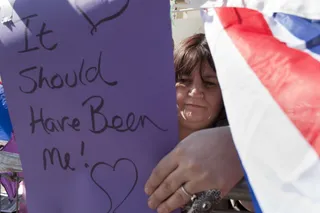 Happy Campers - Faith Nicholson from East London adjusts a sign reading &quot;It should have been me&quot; as she sits in front of her tent in front of Westminster Abbey Wednesday. (Photo: AP Photo/Gero Breloer)