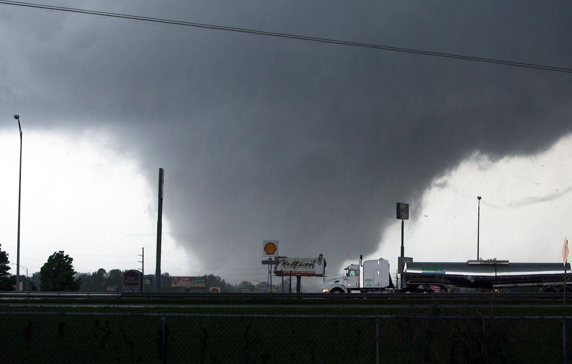 Storm Funnel - One of the hardest-hit areas was Tuscaloosa, a city of more than 83,000 and home to the University of Alabama. A massive tornado barreled through late Wednesday afternoon, leveling the city. <br><br>(Photo: AP Photo/The Tuscaloosa News, Dusty Compton)
