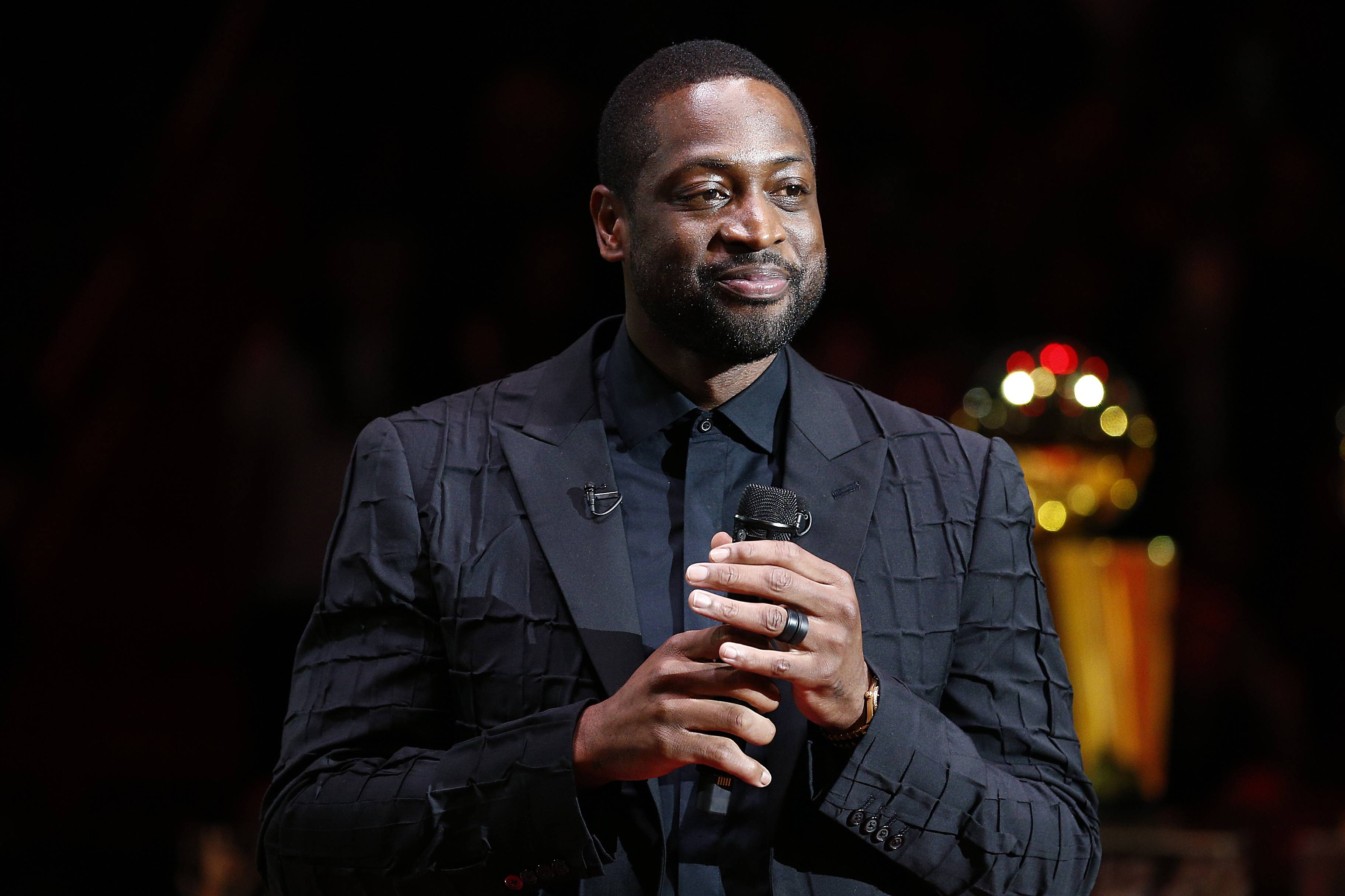 MIAMI, FLORIDA - FEBRUARY 22:  Former Miami Heat player Dwyane Wade addresses the crowd during his jersey retirement ceremony at American Airlines Arena on February 22, 2020 in Miami, Florida. NOTE TO USER: User expressly acknowledges and agrees that, by downloading and/or using this photograph, user is consenting to the terms and conditions of the Getty Images License Agreement.  (Photo by Michael Reaves/Getty Images)