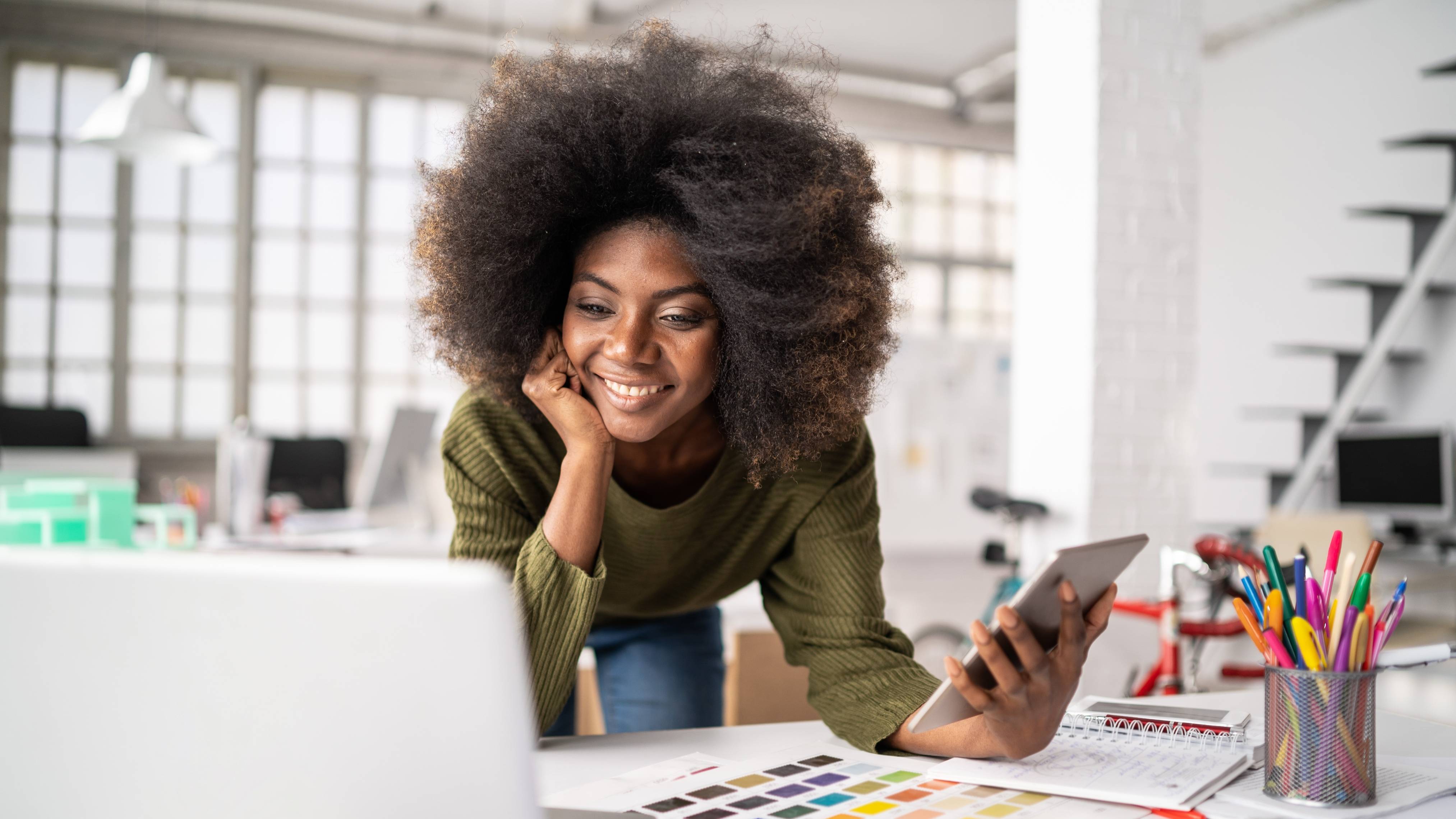 Young fashion designer working in studio.