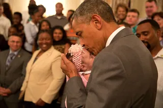 A Kiss Isn't Always Just a Kiss - What little girl wouldn't want to have this photo in her baby book?(Photo: Official White House Photo by Pete Souza)