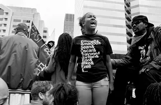 This Has Happened Too Often - A T-shirt lists names of far too many victims of violence. (Photo: Lucas Alvarado-Farrar/Whose Streets Media)