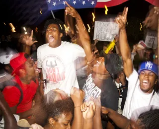 We Need Justice. We Demand It. - LowKey of the The Lost Voices jumps in the air at the Organization for Black Struggle rally.&nbsp;(Photo: Lucas Alvarado-Farrar/Whose Streets Media)