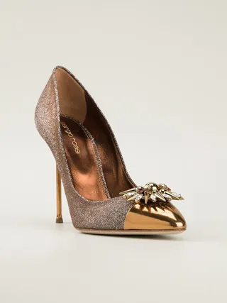 Sergio Rossi Pumps ($460) - This gold pump is the ideal New Year’s shoe. Its pointed frame makes it sophisticated enough for the classy fashionista while its embellishment makes it loud enough for an end-of-year celebration.   (Photo: FarFetch)
