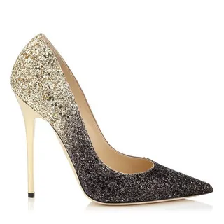 Anouk ($675) - There's no such thing as too much glam at a New Year's Eve party. Strut into 2015 with this jaw-dropping dual-tone glitter pointy-toe pump by Jimmy Choo.   (Photo: Jimmy Choo)
