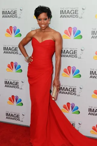 2012: Regina Twirled Down The Carpet In A Red Strapless Gown - (Photo: Getty Images)