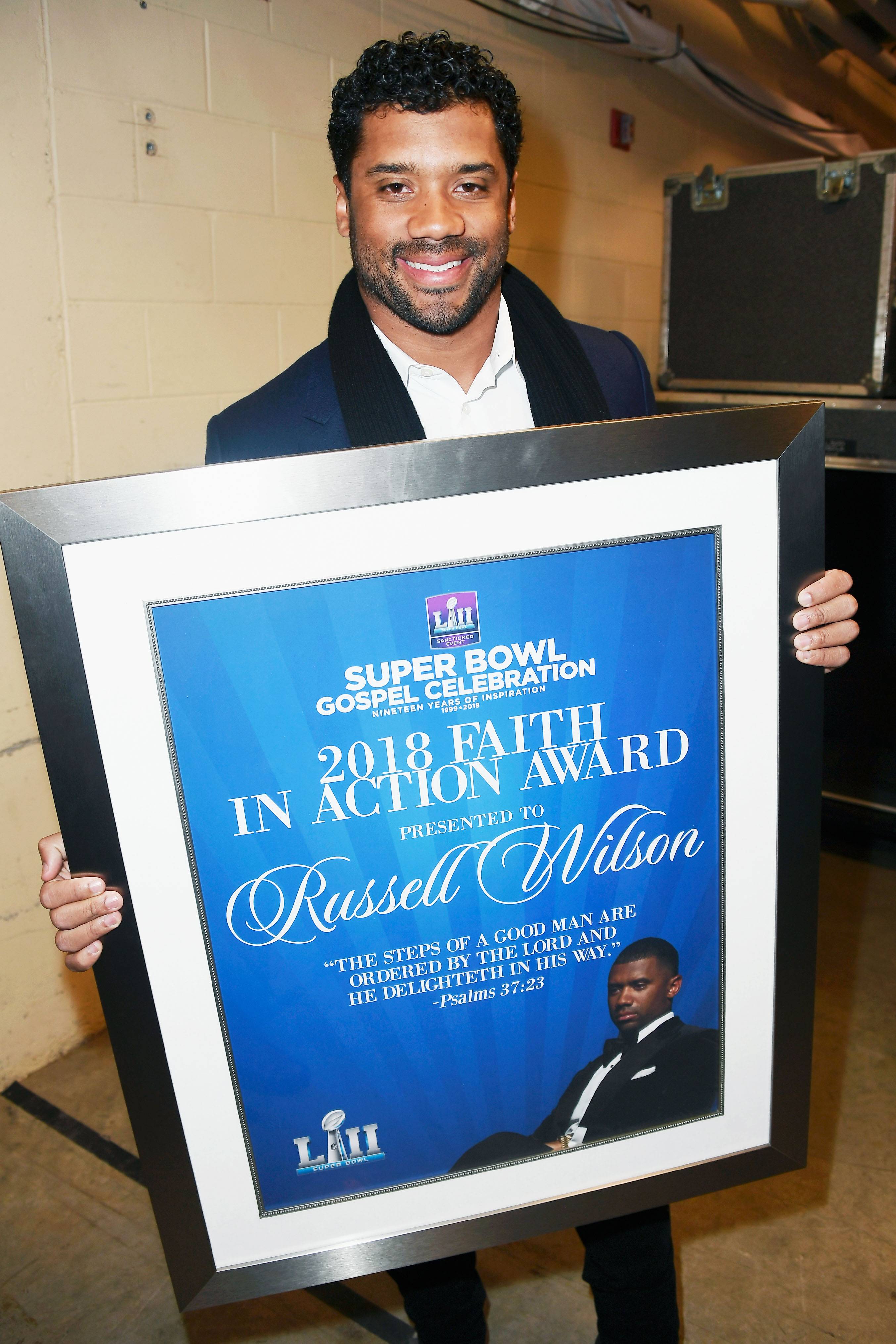 Honoree Russell Wilson Poses With His 2018 Faith In Action Award! - (Photo: Frazer Harrison/Getty Images for BET)