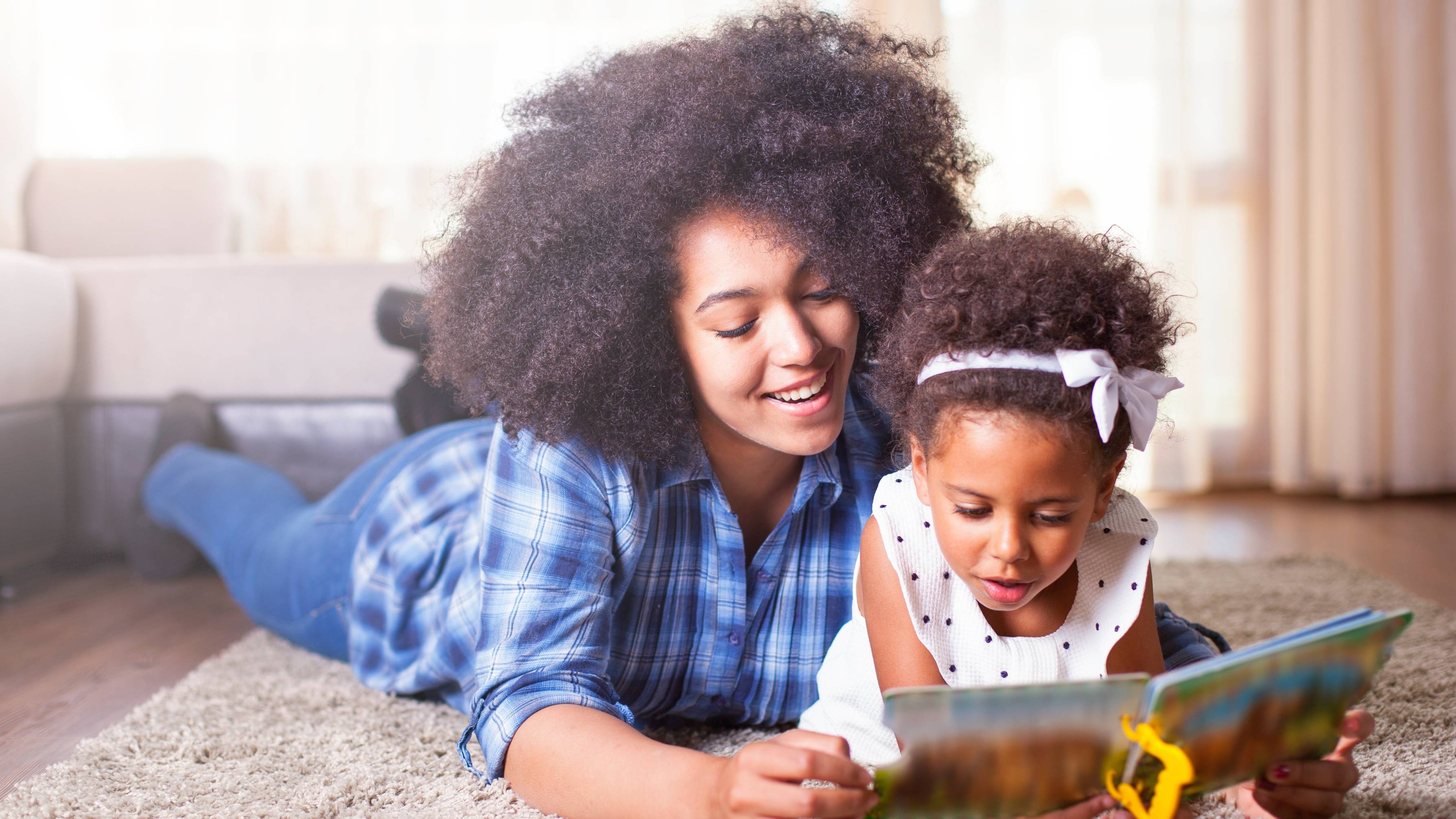 A women and a child reading.