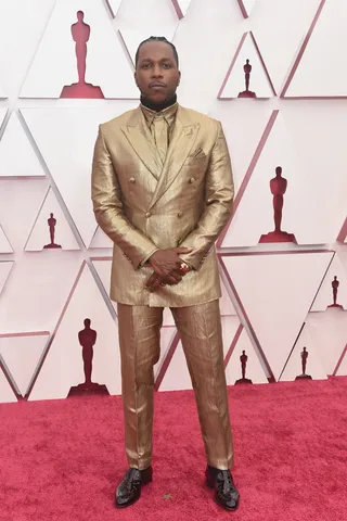 Leslie Odom Jr. stunts in a golden Brioni suit. - (Photo: ABC via Getty Images)