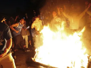 Who Shot Ya? - At least one person was shot during the riots. The gunman fled from the scene and is still unknown. (Photo: AP Photo/The Courier-Journal, Amy Wallot)