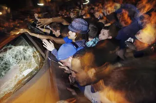 Out of Control - Around 20 people were transported to nearby hospitals for treatment from injuries from fights or having been hit by thrown objects during the riot.(Photo: AP Photo/The Courier-Journal, Amy Wallot)