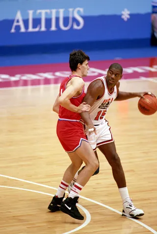 Drive Time - Magic Johnson drives against a Team Croatia player.&nbsp;(Photo:Shaun Botterill/Getty Images)