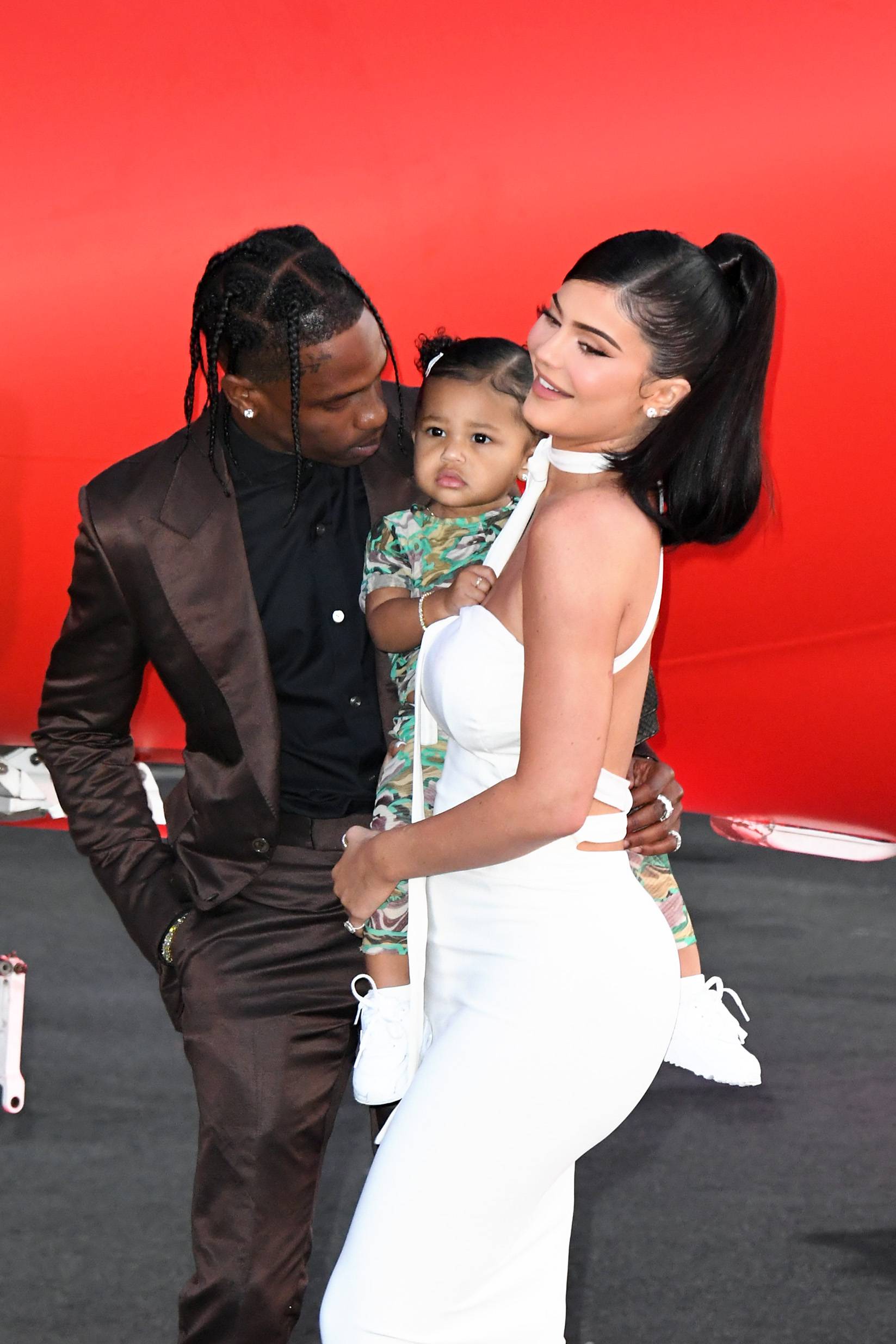 SANTA MONICA, CALIFORNIA - AUGUST 27: (L-R) Travis Scott, Stormi Webster, and Kylie Jenner attend the premiere of Netflix's "Travis Scott: Look Mom I Can Fly" at Barker Hangar on August 27, 2019 in Santa Monica, California. (Photo by Jon Kopaloff/FilmMagic)