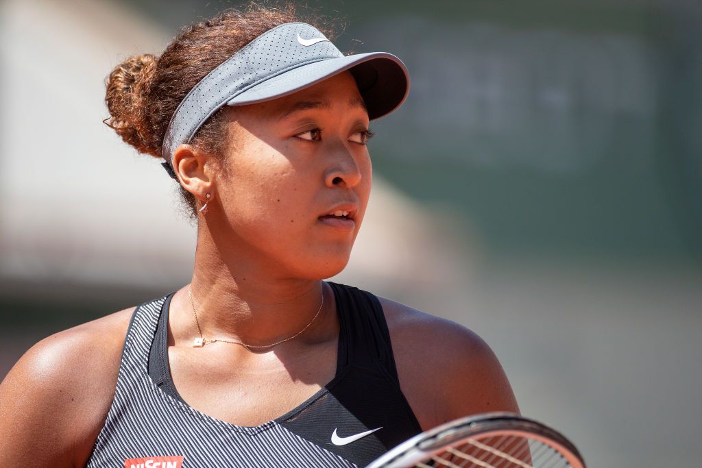 PARIS, FRANCE May 30.  Naomi Osaka of Japan during her match against Patricia Maria Tig of Romania in the first round of the Women's Singles competition on Court Philippe-Chatrier at the 2021 French Open Tennis Tournament at Roland Garros on May 30th 2021 in Paris, France. (Photo by Tim Clayton/Corbis via Getty Images)