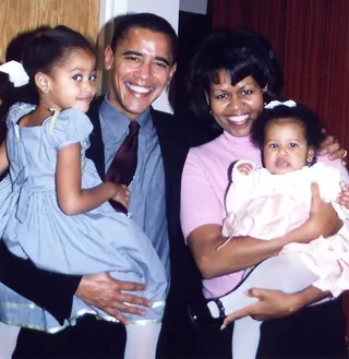 Getting a Boost - The girls soaked up a tender moment with the future president and first lady of the United States. (Photo: Michelle Obama/Facebook)