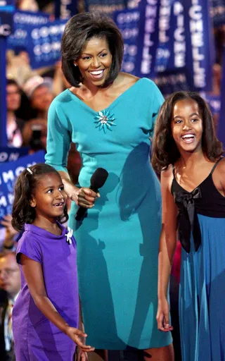 Girl Power - Mrs. Obama and daughters shined in jewel-toned dresses at the Democratic National Convention in 2008. (Photo: John Moore/Getty Images)