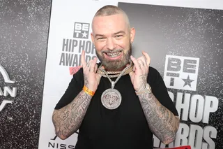 Paul Wall flaunted his blinged out his teeth and neck for his red carpet appeance. - (Photo by Johnny Nunez/2021 BET Hip Hop Awards/Getty Images for BET)