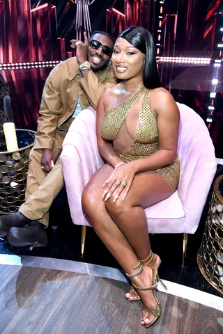 A Boo'd Up Summer! - Megan Thee Stallion accepted her award at the Iheart Music Awards wearing a custom sheer Bryan Hearns dress. Her boyfriend Pardi Fontaine accompanied her matching in a tan Prada look. They look hella fine togther! (Photo: Getty Images)