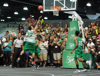 He Got Game - Chris Brown zips past former NBA star Cedric Ceballos on his way to an easy bucket. (Photo: Noel Vasquez/BET/Getty Images for BET)