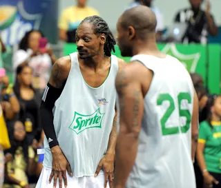 Veterans collide - Snoop Dogg and Tank&nbsp;are either talking game strategy or an upcoming collaboration. (Photo: Noel Vasquez/BET/Getty Images for BET)