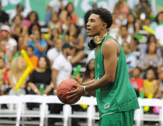 Don't Let Me Enter My Zone - Recording artist Anthony Lewis takes a break from listening to his jams to practice some free throws before taking the court. (Photo: Noel Vasquez/BET/Getty Images for BET)