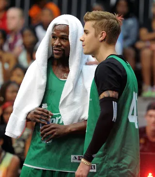 The Money Team - Floyd Mayweather Jr. and his new friend Justin Bieber chop it up before leaving it all out on the floor at the Sprite Celebrity Basketball Game. (Photo: Noel Vasquez/BET/Getty Images for BET)