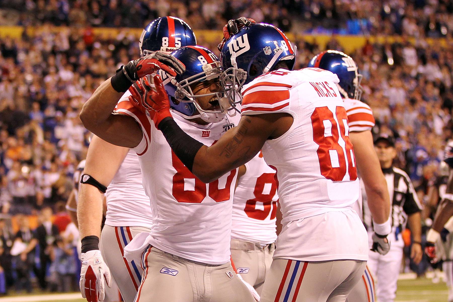 Salsa Dancer Delivers - Hakeem Nicks (#88) celebrated with teammate Victor Cruz (#80) after Cruz hauled in a two-yard TD pass from Eli Manning in the first quarter. Moments later, Cruz unleashed his trademark end-zone dance.(Photo: Jamie Squire/Getty Images)