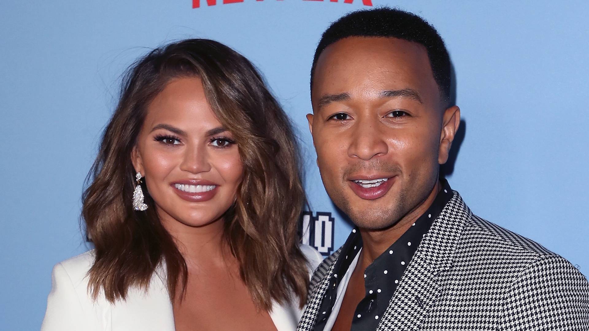 John Legend and Chrissy Teigen on BET Buzz 2020.