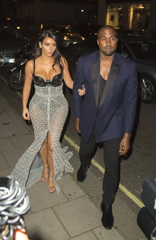 Make Way - The paparazzi trip all over themselves and each other trying to get a photo of Kim Kardashian and Kanye West&nbsp;as they arrive at their hotel after Kim wins Woman of the Year at the GQ Awards in London. (Photo: Ringo, PacificCoastNews)