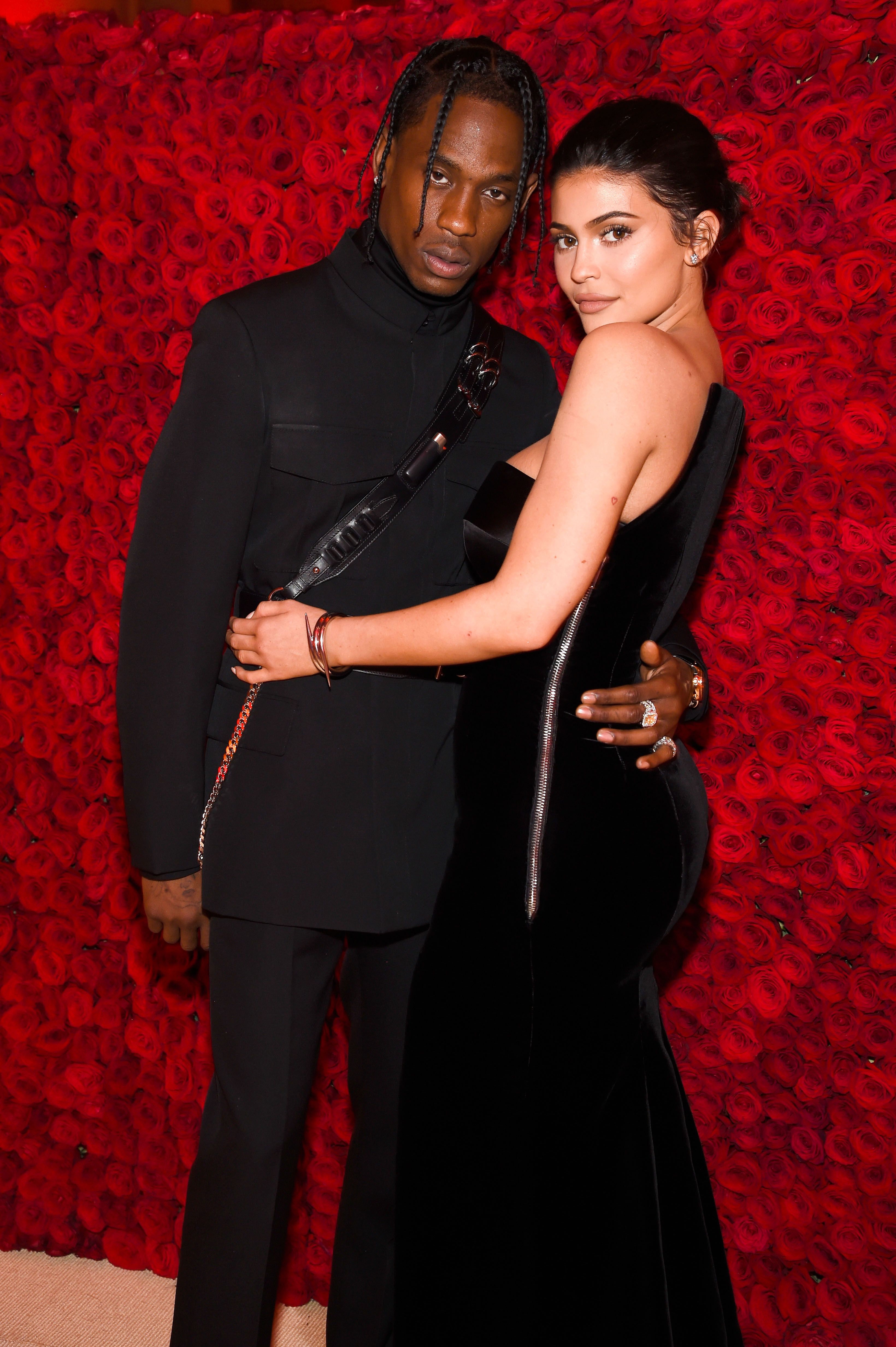 NEW YORK, NY - MAY 07:  Travis Scott (L) and Kylie Jenner attend the Heavenly Bodies: Fashion & The Catholic Imagination Costume Institute Gala at The Metropolitan Museum of Art on May 7, 2018 in New York City.  (Photo by Kevin Mazur/MG18/Getty Images for The Met Museum/Vogue)