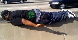 Glasses Malone - Living in Los Angeles means living with traffic. Rapper Glasses Malone spiced up his afternoon commute by balancing his hefty frame on a center divider of California's Freeway 5 in rush hour traffic.(Photo: TwitPic.com) &nbsp;